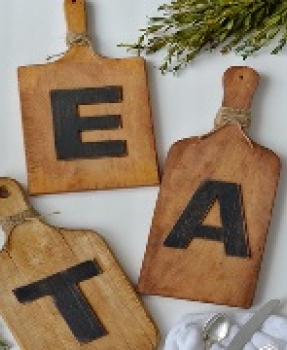 cutting boards with the word Eat